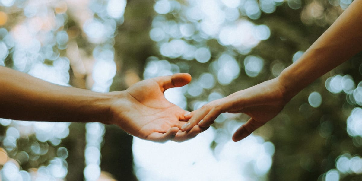humans holding hands and feeling connection